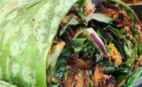 Fresh wraps filled with chicken, vegetables, and cheese, perfect for a healthy meal.