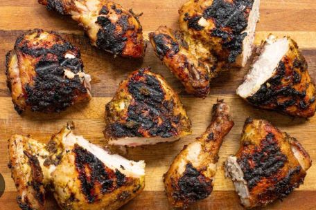 Savory roasted chicken served with fresh salad and baked side dishes.