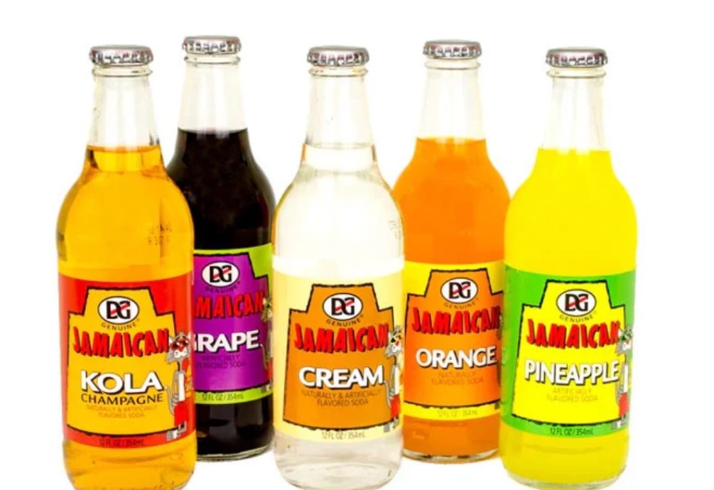 Close-up of vibrant Mizu Mate and Vegan Cola soda cans, showcasing flavors and design.